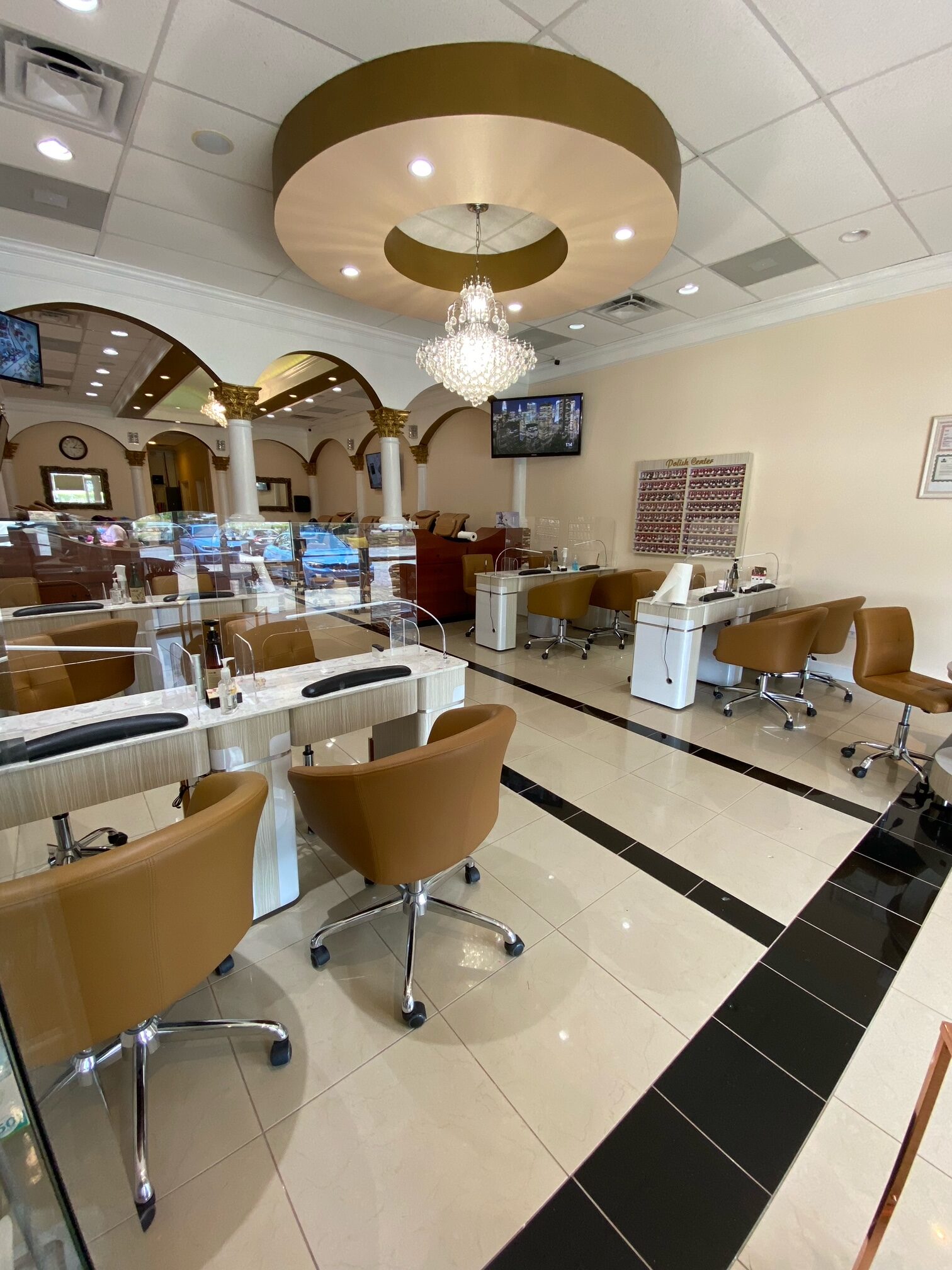 Manicure stations beneath chandelier